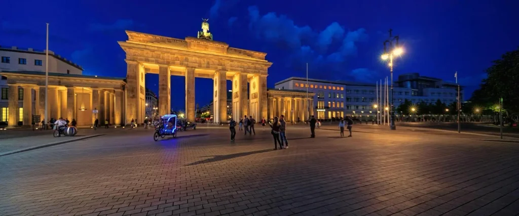Complete guide to Berlin showing Brandenburg Gate and city skyline